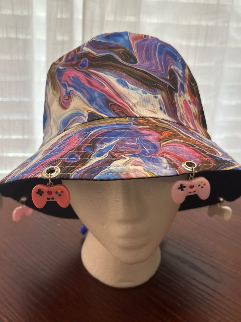 Multicolor Swirl Bucket Hat with Pink Game Controller Charms